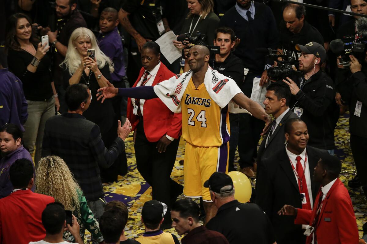 Lakers World - Bill Russell rocking a Kobe Bryant jersey