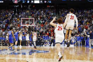 Louisville, KY - March 26: San Diego State players start to celebrate as time expired in a 57-56 victory over Creighton in an Elite 8 game in the NCAA Tournament on Sunday, March 26, 2023 in Louisville, KY. (K.C. Alfred / The San Diego Union-Tribune)
