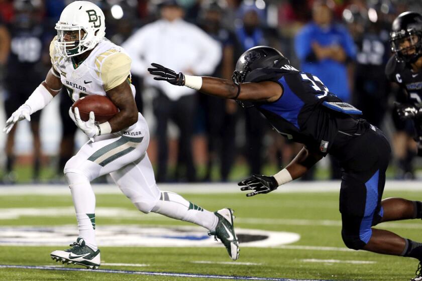 Baylor running back Shock Linwood breaks free against Buffalo to score one of his two touchdowns on Friday night.