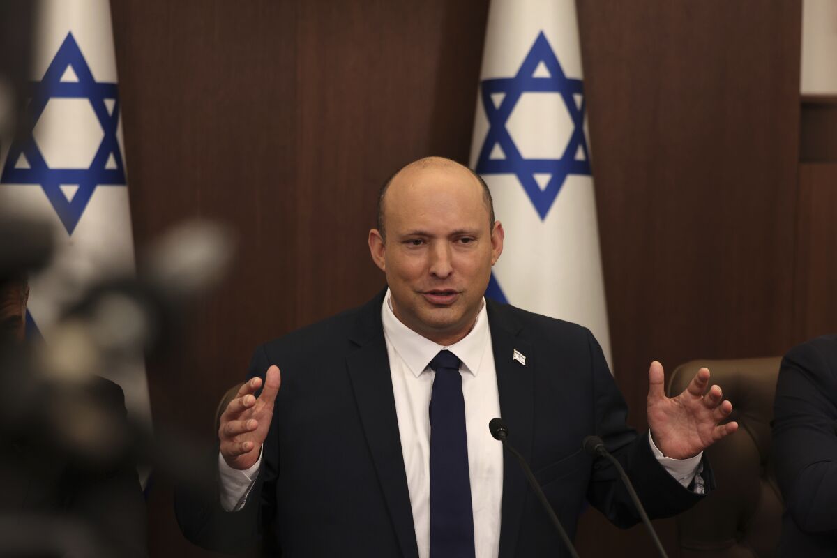 FILE - Israeli Prime Minister Naftali Bennett speaks during a weekly cabinet meeting in Jerusalem on Sunday, May 1, 2022. Bennett says he accepted an apology from Russian President Vladimir Putin for controversial remarks about the Holocaust made by Moscow’s top diplomat. But there was no mention of an apology in the Russian statement on Thursday, May 4, call between the two leaders. (Menahem Kahana/Pool Photo via AP, File)