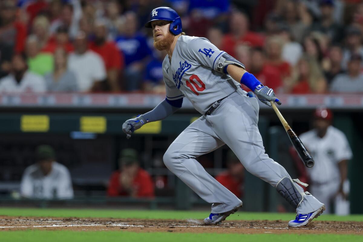 Dodgers third baseman Justin Turner bats against the Cincinnati Reds in a 3-1 loss Friday.