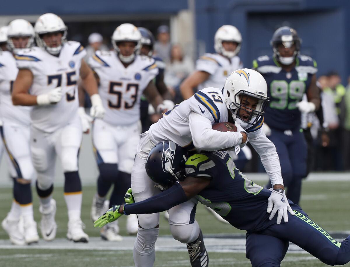 Chargers wide receiver Keenan Allen makes a catch against Seattle Seahawks cornerback Justin Coleman in a Nov. 4 game at CenturyLink Field in Seattle.