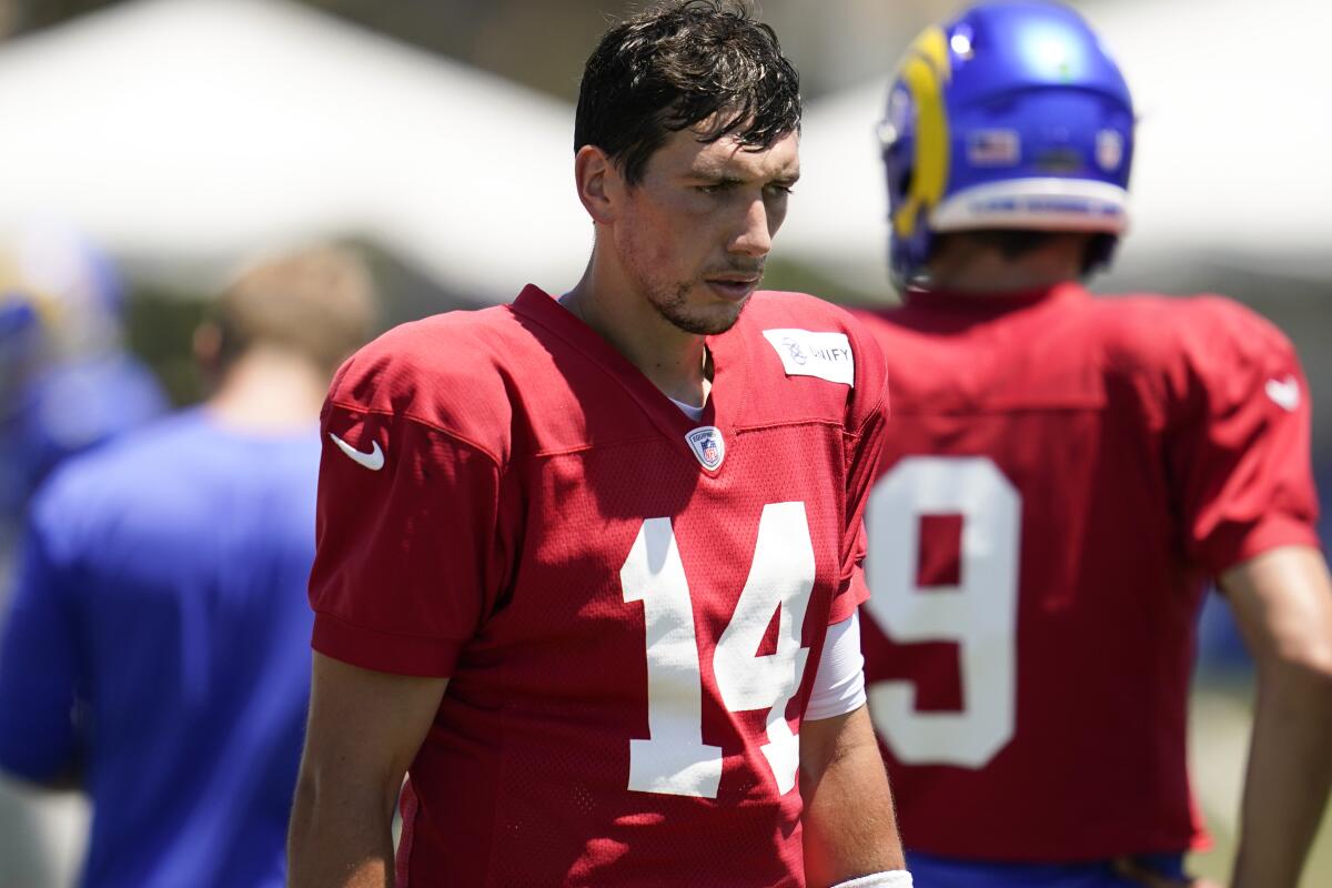 Quarterback Luis Perez (14) participates in drills during Rams camp in 2022.