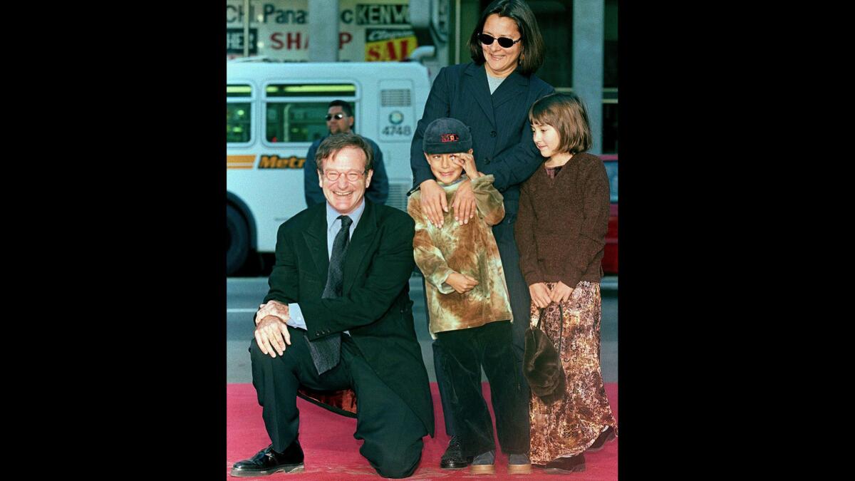 Robin Williams with son Cody, center, daughter Zelda and then-wife Marsha Garces in December 1998 at the actor's handprint and footprint ceremony on Hollywood Boulevard. Son Cody Williams joined his mom and older siblings Tuesday in issuing statements the comic-actor.