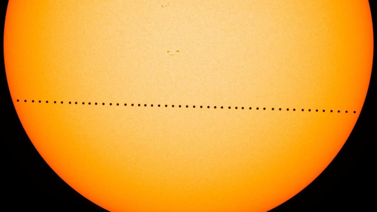 In this composite image, the planet Mercury passes directly between the sun and Earth on May 9, 2016. Another transit will happen Nov. 11. 