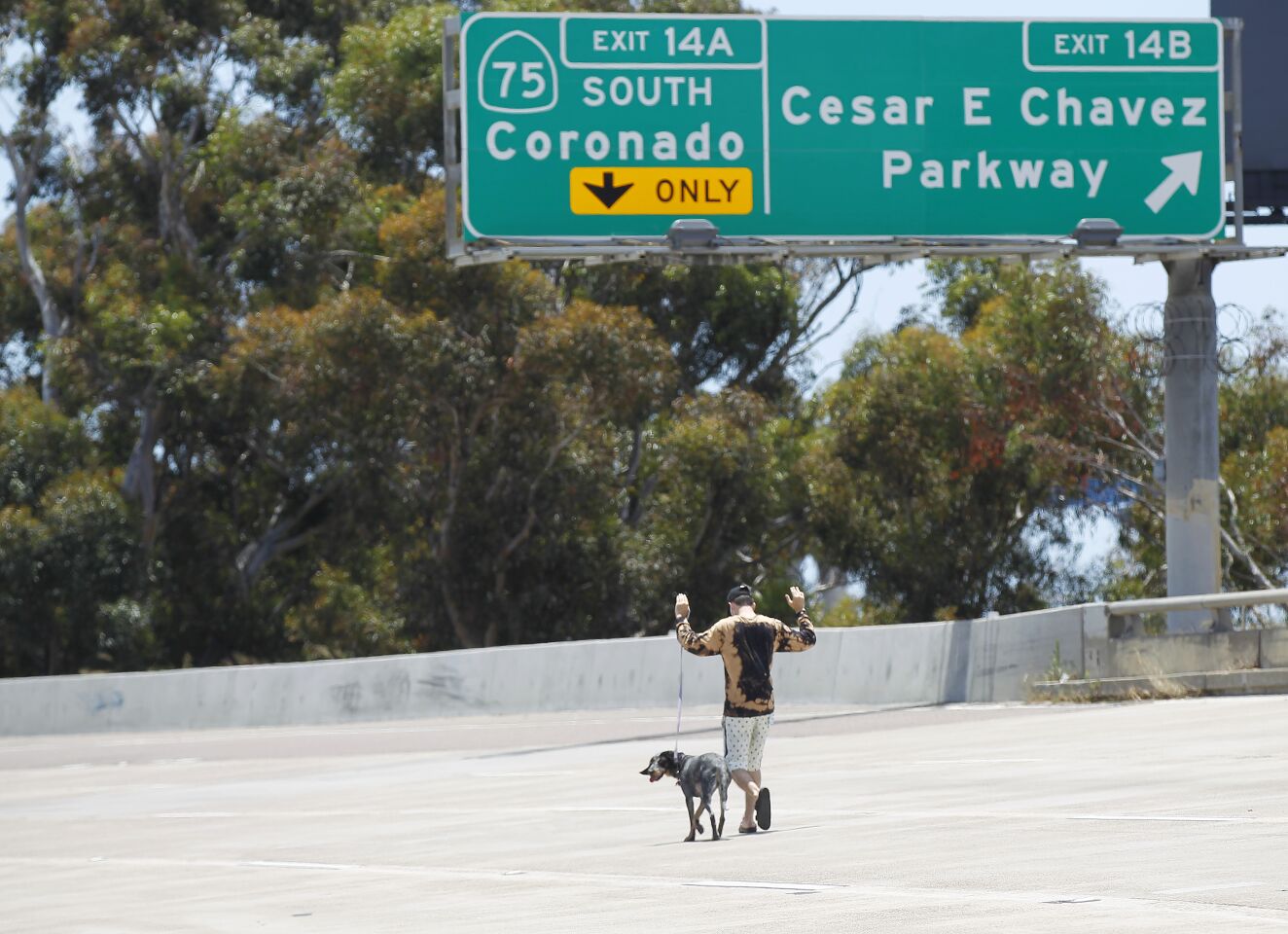 A protester walks down I-5 in downtown San Diego on May 31, 2020.