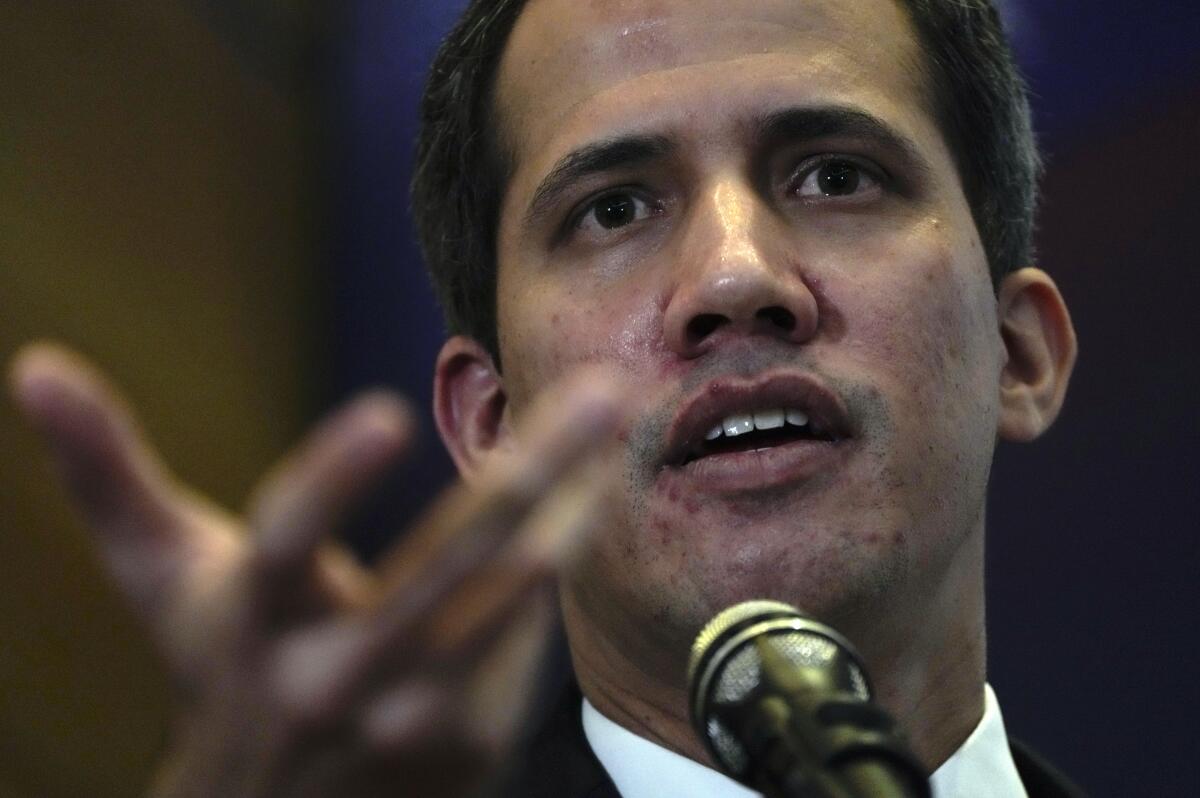 Opposition leader Juan Guaido explains the income and expenses of his self-proclaimed, parallel government in Caracas, Venezuela, Friday, Sept. 16, 2022. The U.S. and other nations recognized Guaido as Venezuela’s interim president when they withdrew recognition of President Nicolas Maduro after accusing him of rigging his 2018 re-election as president. (AP Photo/Ariana Cubillos)