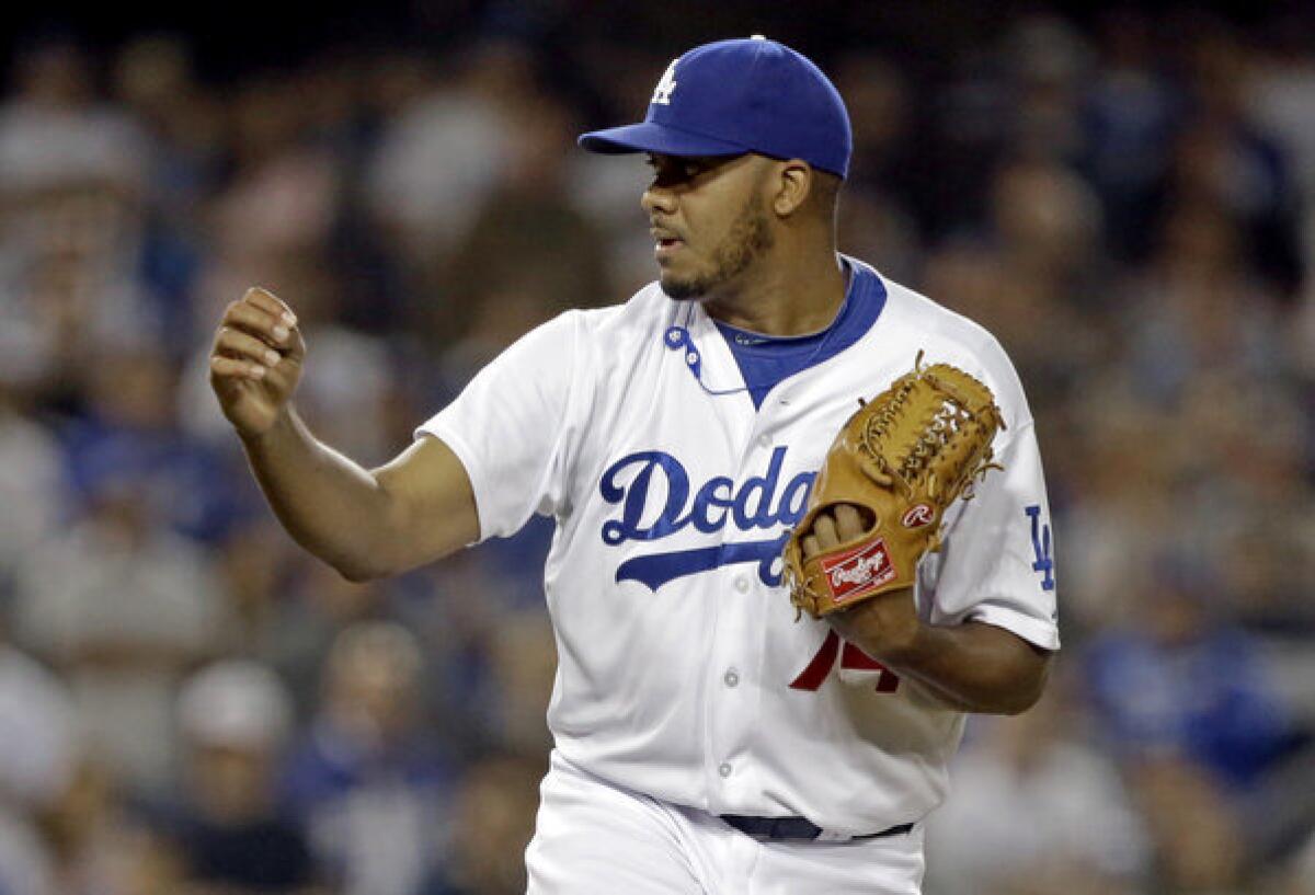 Kenley Jansen, named the Dodgers' closer Tuesday, pumps his fist after getting the final out against the Washington Nationals in May.