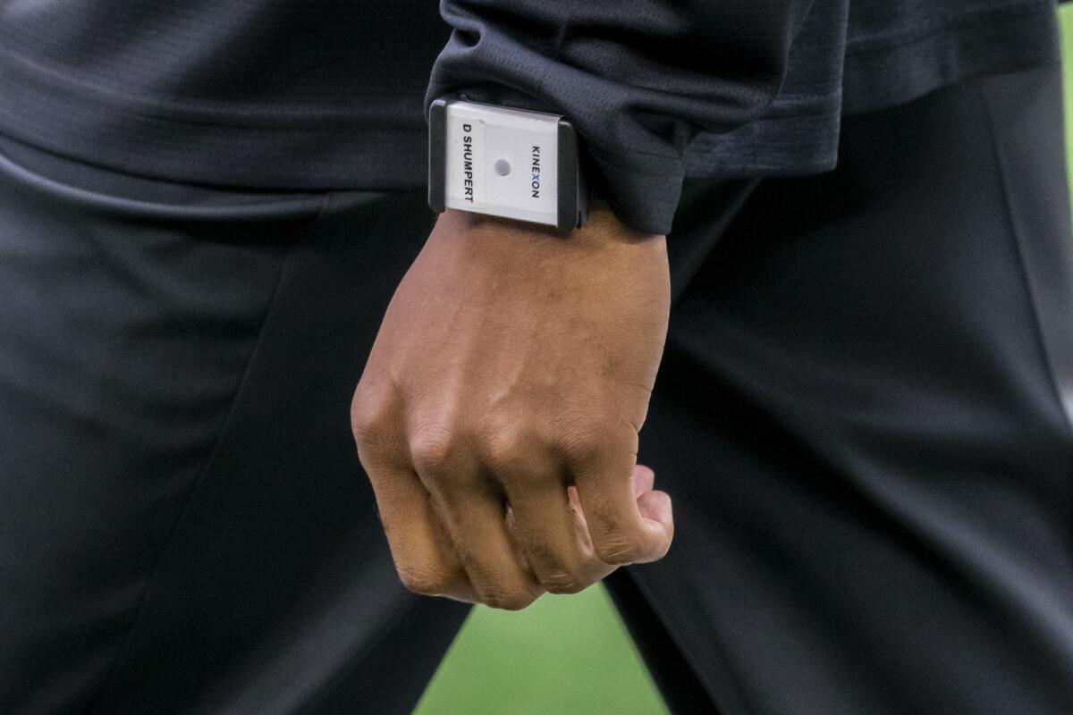 Arizona Cardinals offensive assistant Don Shumpert wears an Kinexon health tracking device.