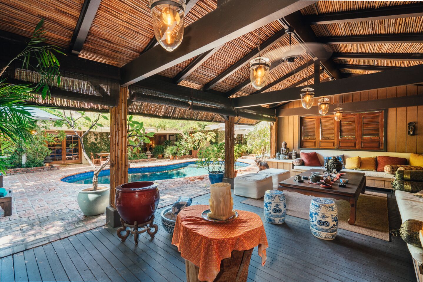The lanai features open-beam ceilings and seating for 15.