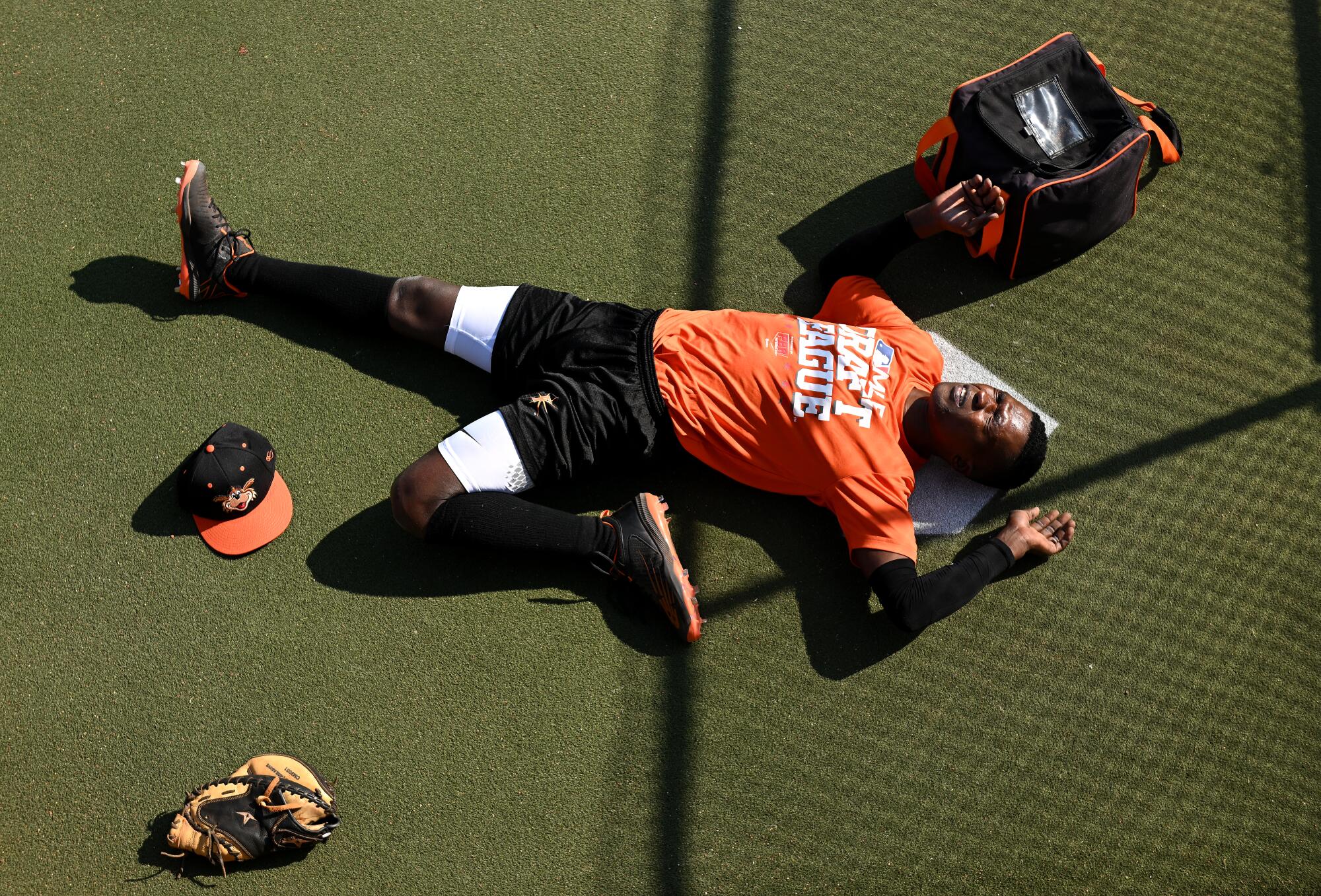 Frederick Keys player Dennis Kasumba stretches before a game with the Trenton Thunder.