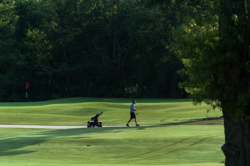 A man uses a remote control robot in Bobby Jones Golf Course in Atlanta.