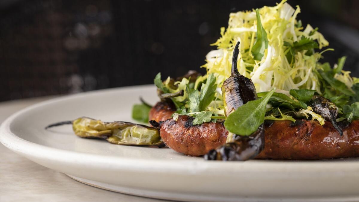 Linguisa pinwheel sausage with a frisée salad at Dama restaurant in downtown L.A.