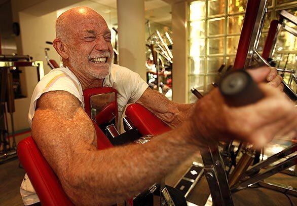 Don Wildman, founder of Bally's Total Fitness, works out in the state-of-the art gym at his Malibu home. Three days a week, the 76-year-old leads the "Circuit" at his gym, a grueling two-hour weight regimen of his own creation that's become legendary in Malibu and beyond.