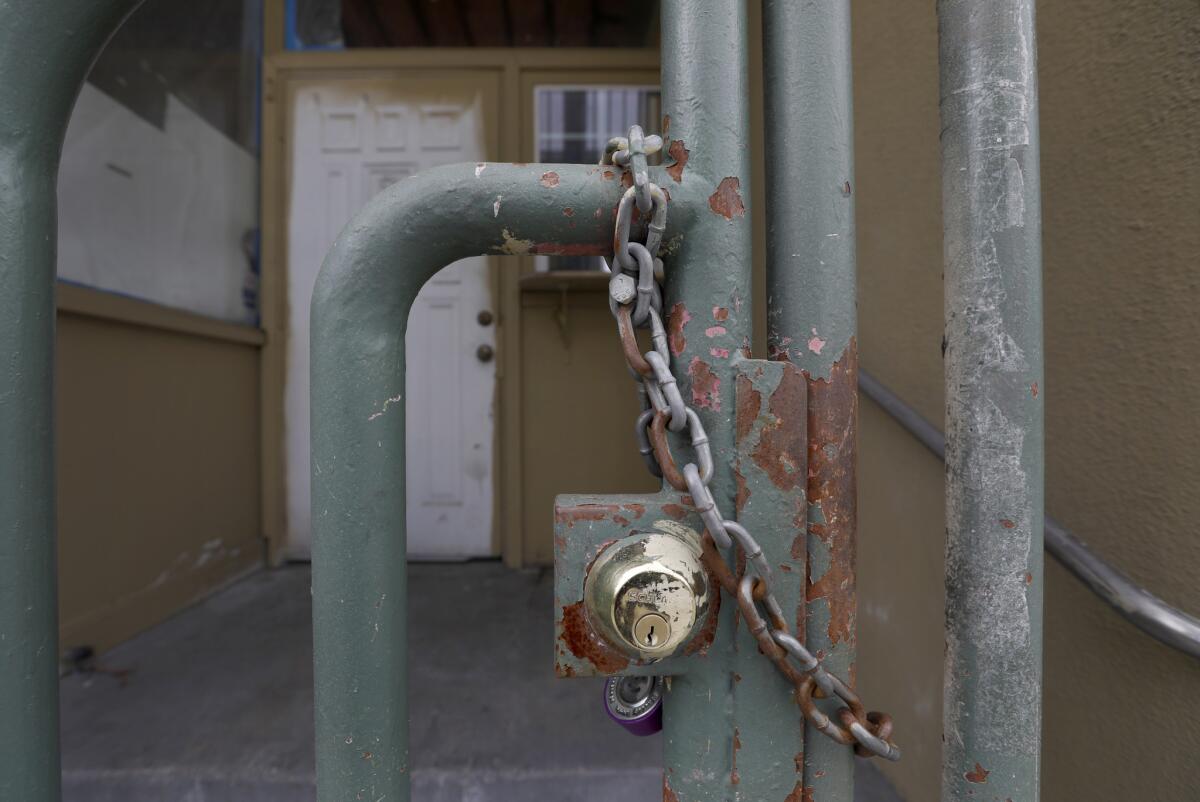 A lock on a gate at the building formerly known as the Royal Park Motel in Los Angeles on March 20.