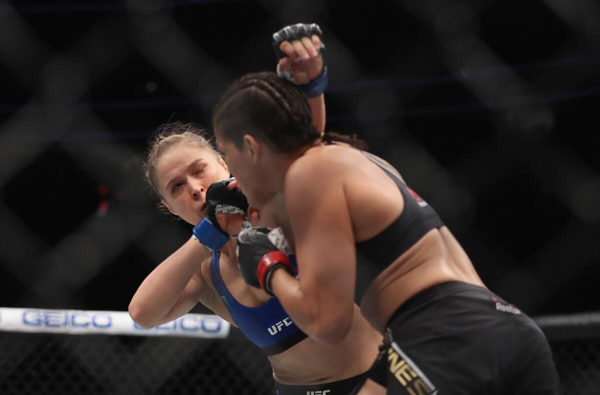 Amanda Nunes puts Ronda Rousey on the defensive during their bantamweight title bout on Friday night at UFC 207.