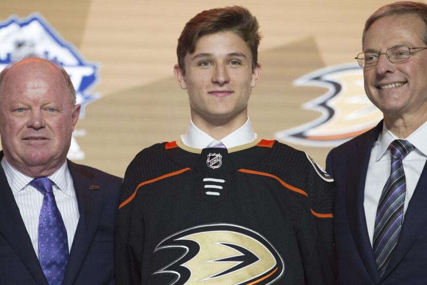 Anaheim Ducks draft pick Trevor Zegras wears an Anaheim jersey during the first round of the NHL hockey draft Friday, June 21, 2019, in Vancouver, British Columbia. (Jonathan Hayward/The Canadian Press via AP)
