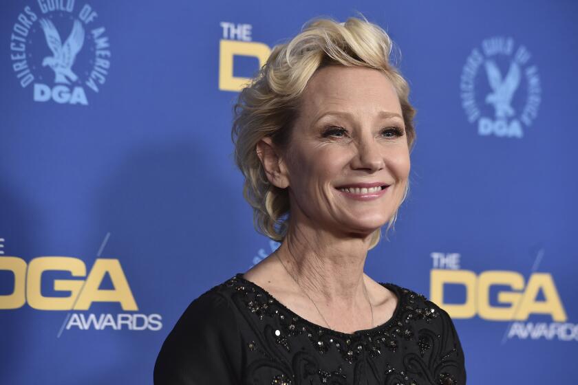 FILE - Anne Heche arrives at the 74th annual Directors Guild of America Awards on March 12, 2022, in Beverly Hills, Calif. Heche, who first came to prominence on the NBC soap opera “Another World” in the late 1980s before becoming one of the hottest stars in Hollywood in the late 1990s, died Sunday, Aug. 14, 2022, nine days after she was injured in a fiery car crash. She was 53. (Photo by Jordan Strauss/Invision/AP, File)