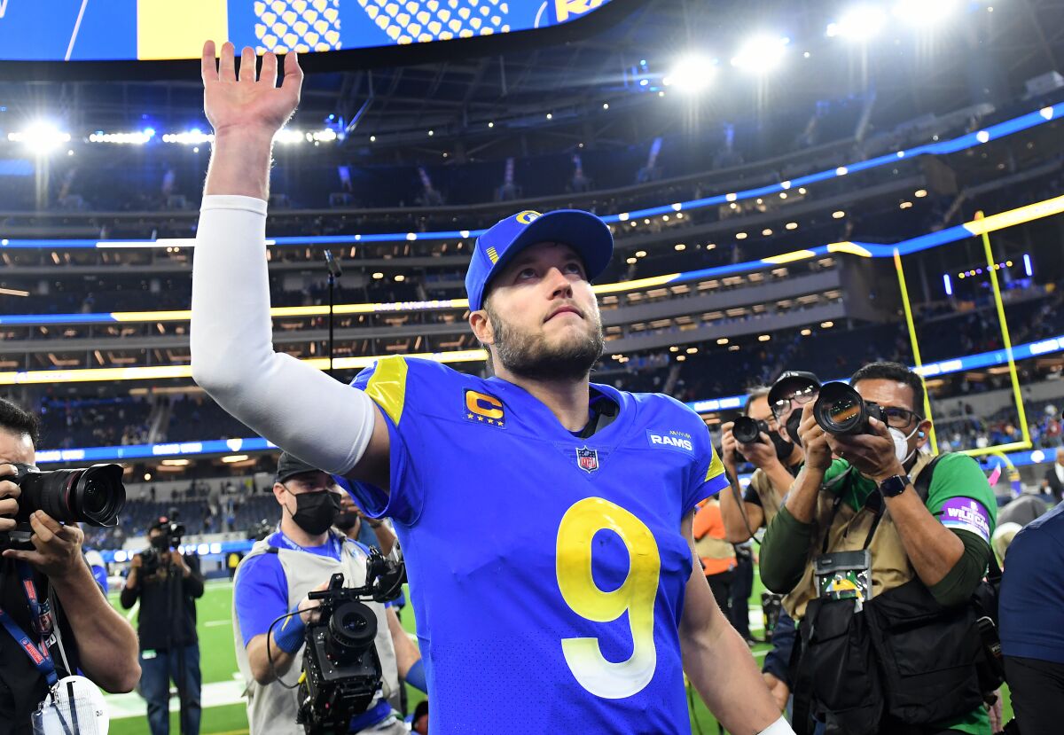  Rams quarterback Matthew Stafford waves to the fans after defeating the Cardinals in an NFC wild-card playoff game.