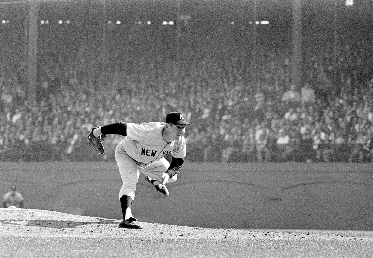 New York Yankees pitcher Whitey Ford throws during the sixth game of the 1960 World Series against the Pittsburgh Pirates.