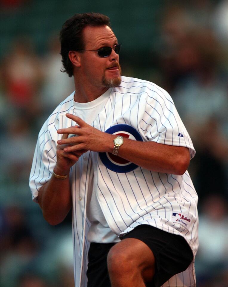 Former Bears quarterback Jim McMahon throws the ceremonial first pitch before the start of Cubs against the Astros at Wrigley Field on Aug. 13, 2002.