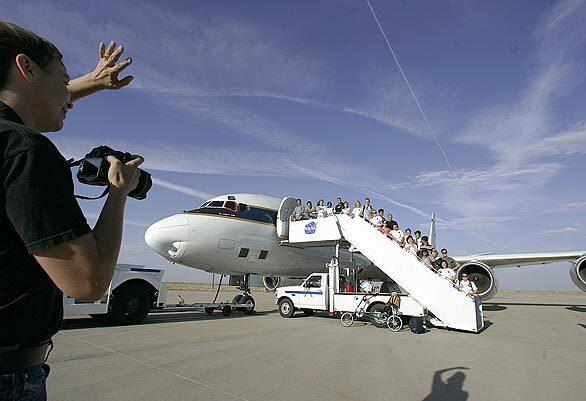 A crew of 47 undergraduate and graduate students, middle and high school teachers, and scientists boards the NASA-owned DC-8 "Flying Laboratory" at Dryden Aircraft Operations Facility, in Palmdale, as part of the student airborne research program.