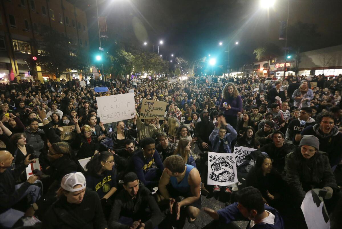Protesters sit on Shattuck Avenue in Berkeley in December in response to police killings in Missouri and New York.