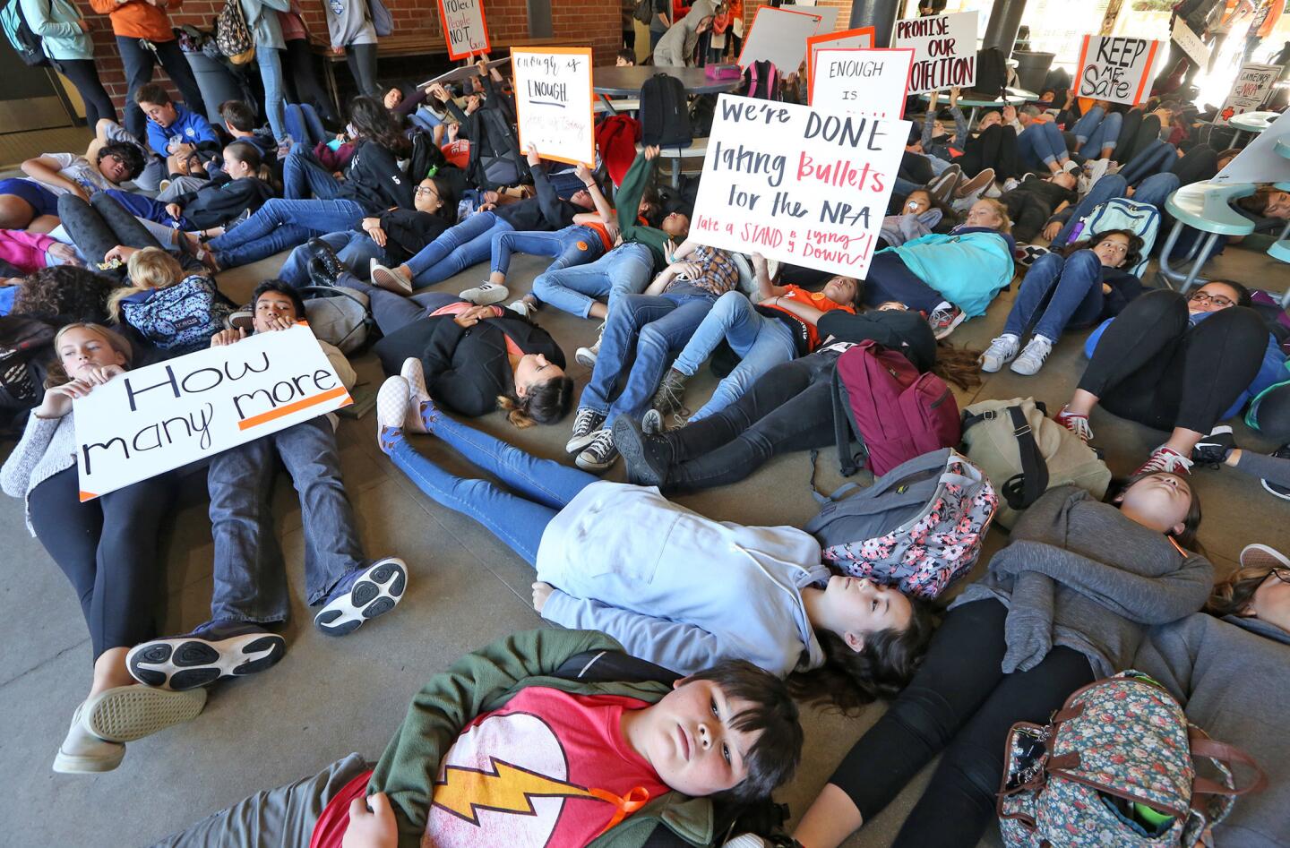 Rosemont Middle School students participate in a a "Die-Inevent" held in conjunction with nationwide school walkouts promoting new gun legislation.