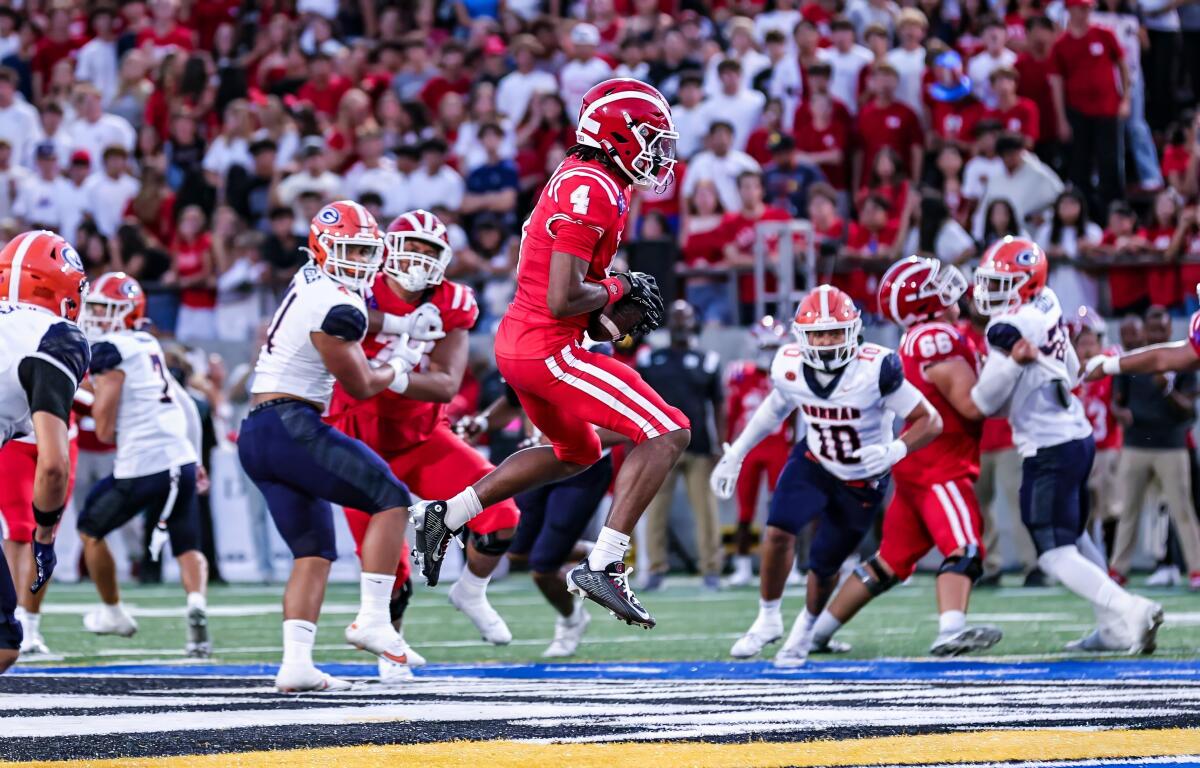 Mater Dei receiver Kayden Dixon-Wyatt makes a catch against Bishop Gorman on Friday night at Santa Ana Stadium.