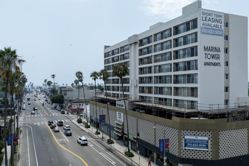 Venice, CA - July 11: An Airbnb advertised as a "Sunset studio in Marina Del Rey," is actually in this building at 415 Washington Blvd., right, on Thursday, July 11, 2024 in Venice, CA. (Brian van der Brug / Los Angeles Times)