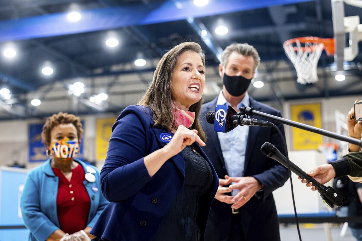 Oakland Mayor Libby Schaaf, center, speaks to the media.