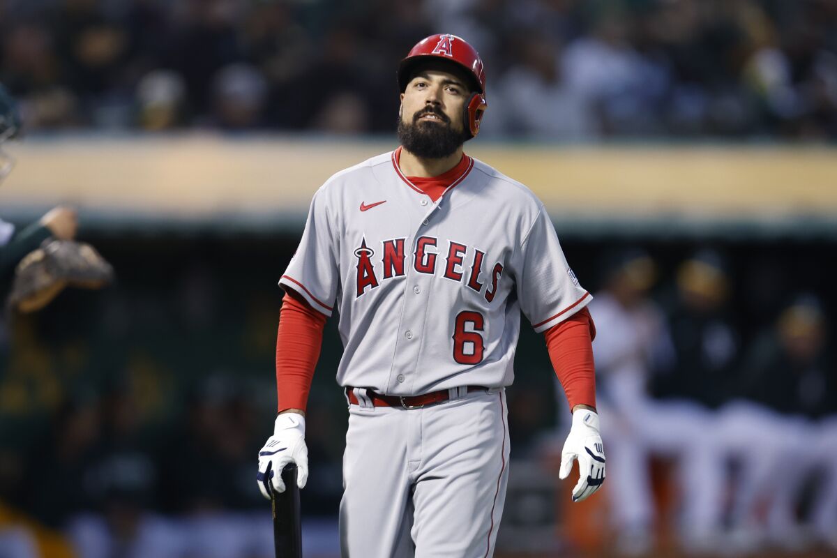 Angels third baseman Anthony Rendon walks to the dugout during a season-opening loss to the Oakland Athletics.