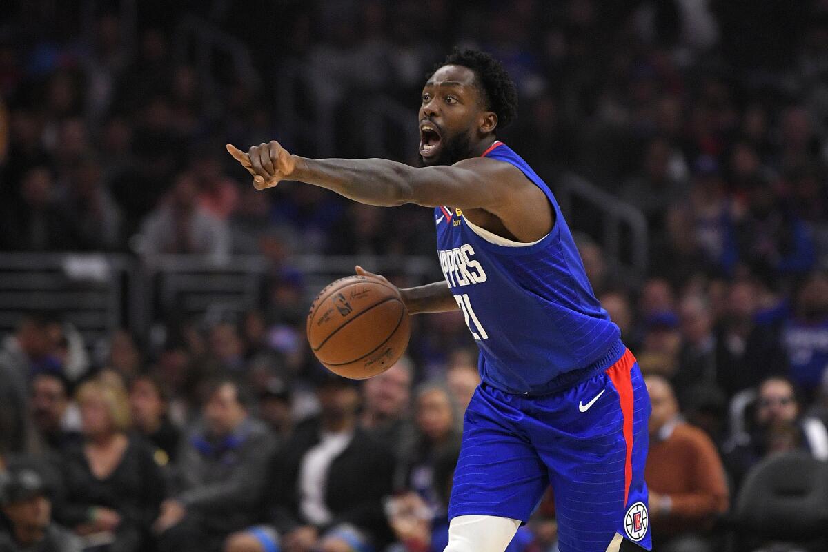 Clippers guard Patrick Beverley directs the offense during the first half of a game against Philadelphia.