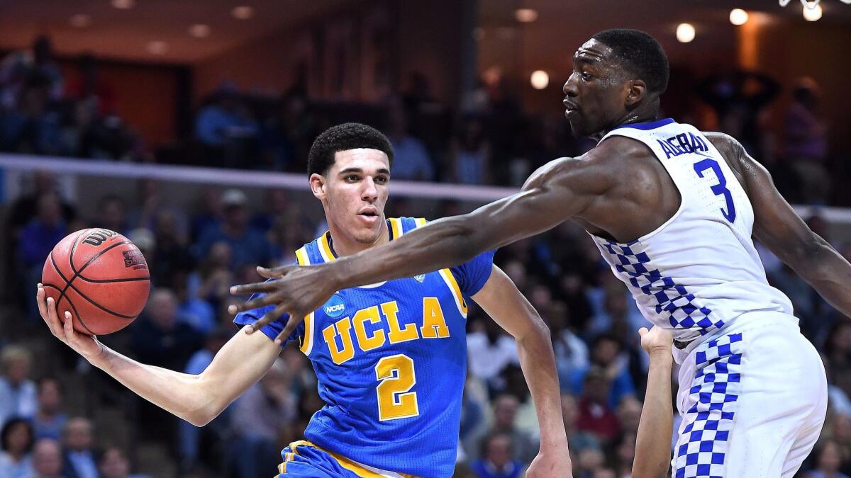 UCLA's Lonzo Ball gets a pass off against Kentucky in the third round of the NCAA Tournament in Memphis Friday.