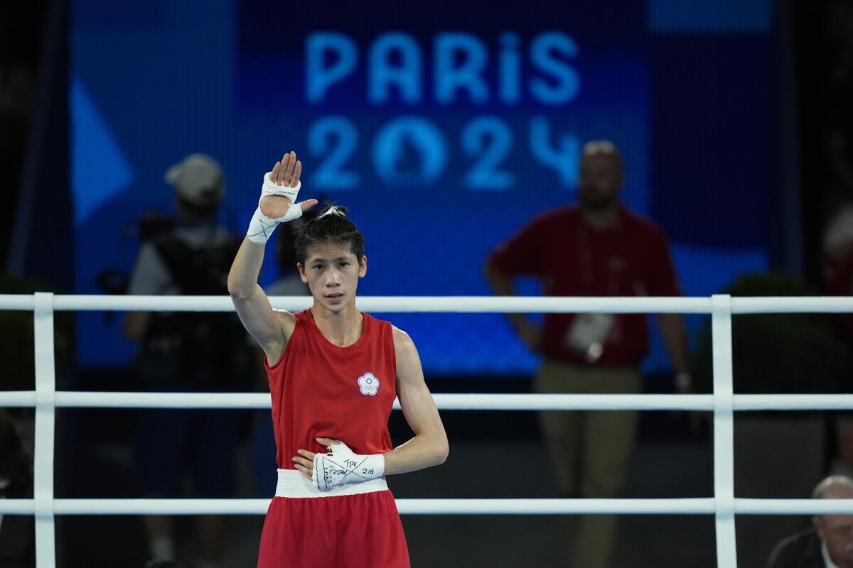 Taiwan's Lin Yu-ting celebrates after defeating Turkey's Esra Yildiz in their women's 57 kg semifinal boxing match 