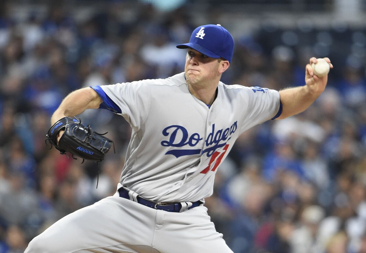 Left-hander Alex Wood was not on the Dodgers' roster for the division series playoff.