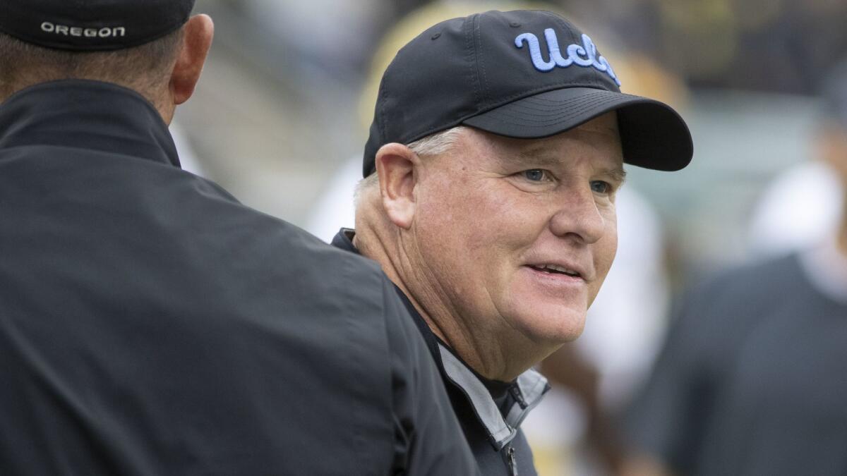 UCLA coach Chip Kelly roams the field before the Bruins played Oregon on Nov. 3.