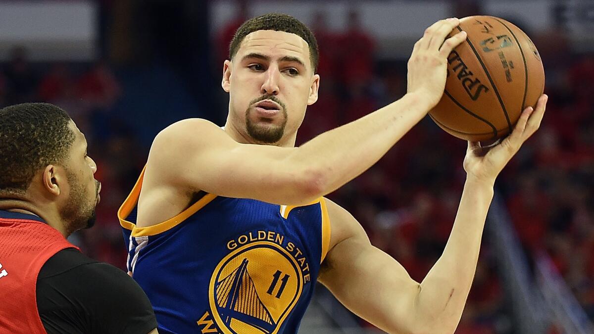 Golden State Warriors guard Klay Thompson looks to pass against the New Orleans Pelicans during Game 3 of the Western Conference quarterfinals on April 23.