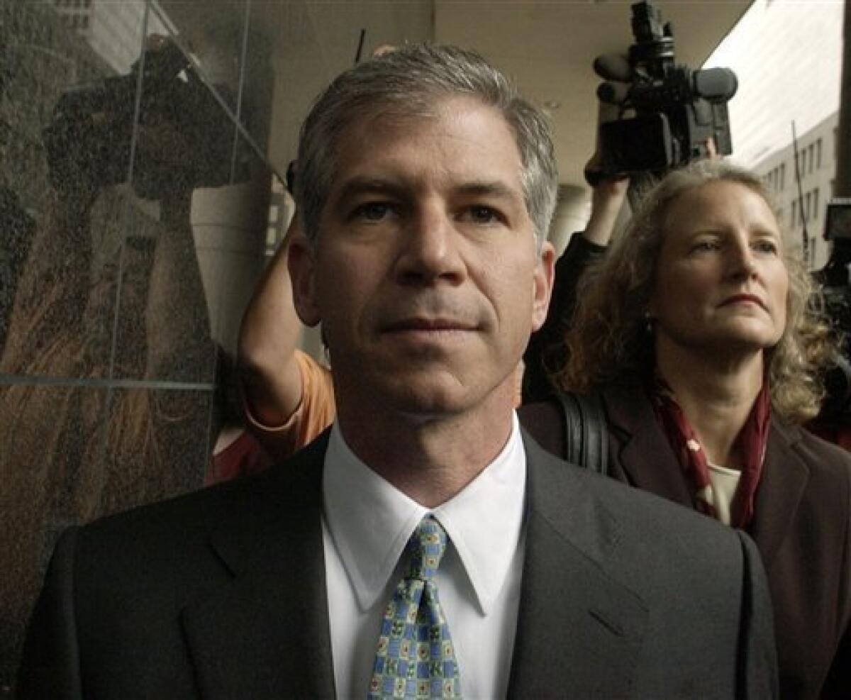FILE - In this Jan. 14, 2004, file photo former Enron finance chief Andrew Fastow, center, arrives for court in Houston with his attorney Jan Little. The Federal Bureau of Prisons website shows Fastow was moved from a Pollack, La., prison to a low-security community corrections facility in Houston. Fastow is considered the mastermind behind the financial schemes that doomed Enron. (AP Photo/David J. Phillip, file)