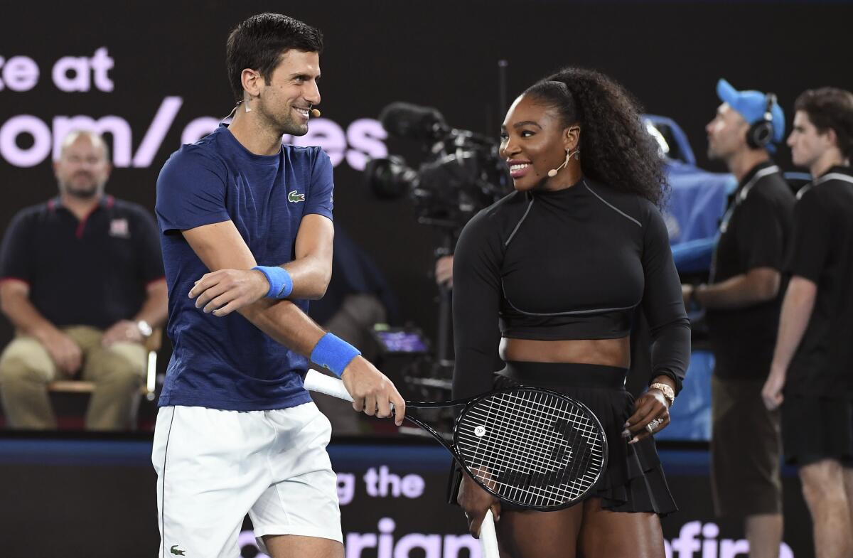 Serena Williams and Novak Djokovic share a moment during a Rally for Relief charity event on Jan. 15 in support of the victims of the Australian bushfires.