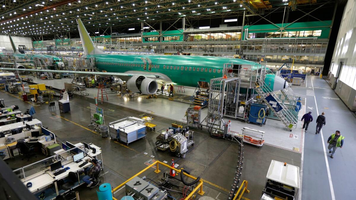 Boeing 737-800 airplanes are on the assembly line in Renton, Wash., in 2014