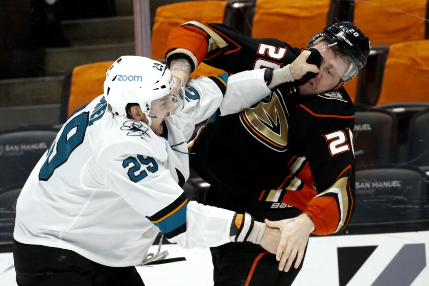 The Sharks' Kurtis Gabriel, left, and Ducks' Nicolas Deslauriers fight during the first period March 12, 2021.