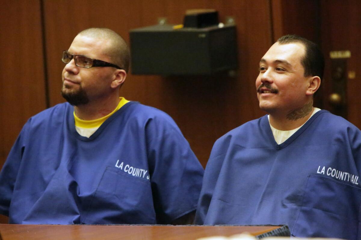 Marvin Norwood, 34, left, and Louie Sanchez, 32, who both admitted to assaulting a San Francisco Giants fan at a Dodgers game in 2011, appear in Los Angeles County Superior Court. Norwood later pleaded guilty to a federal weapons charge.