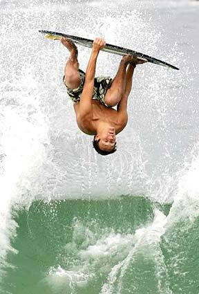 Morgan Just, 19, skimboards at Laguna Beach.