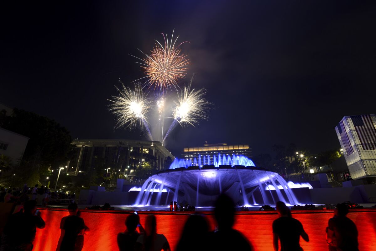Fireworks erupt at the Music Center during the Grand Park Fourth of July Block Party.