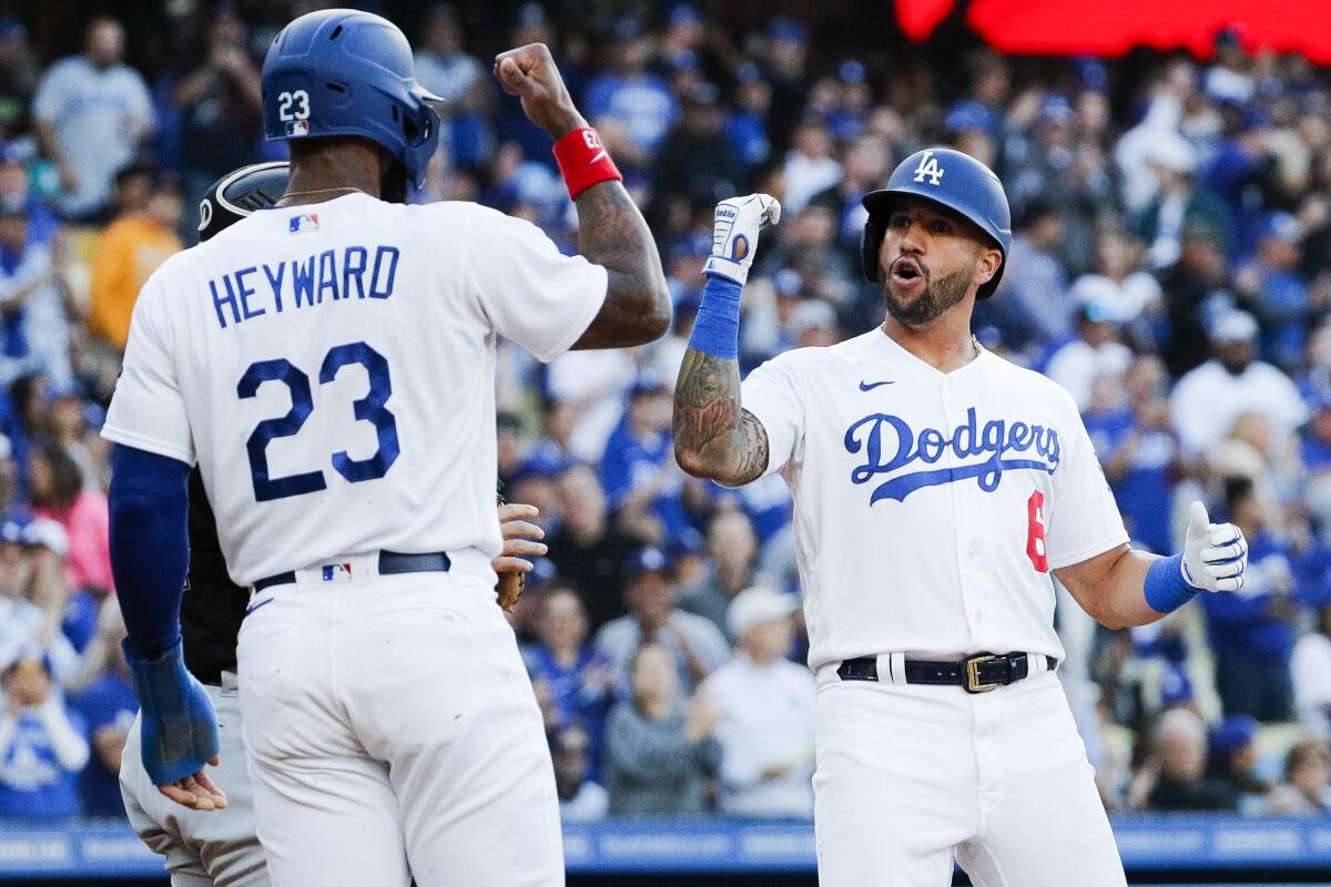Dodgers' David Peralta, right, celebrates his home run with Jason Heyward against the Chicago White Sox on June 13, 2023.