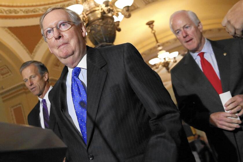 Senate Majority Leader Mitch McConnell (R-Ky.) arrives to answer questions after a weekly policy meeting at the U.S. Capitol.