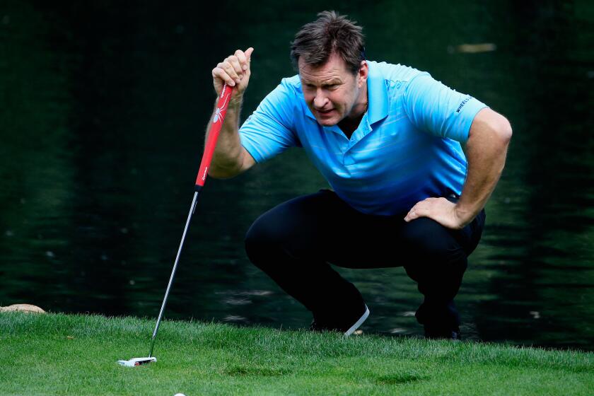 Nick Faldo lines up a putt during the Par 3 Contest prior to the start of the Masters at Augusta National Golf Club on April 8.