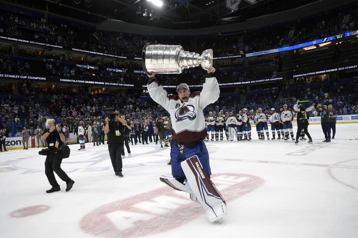Colorado Avalanche goaltender Darcy Kuemper skates with the Stanley Cup following the team's championship win in June 2022.
