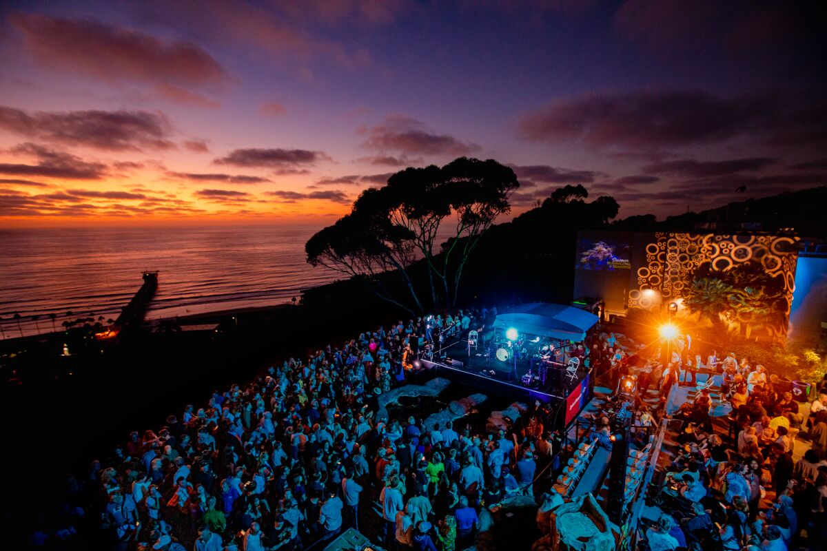The band 10,000 Maniacs is shown performing in 2019 at the Green Flash concert series at La Jolla's Birch Aquarium.